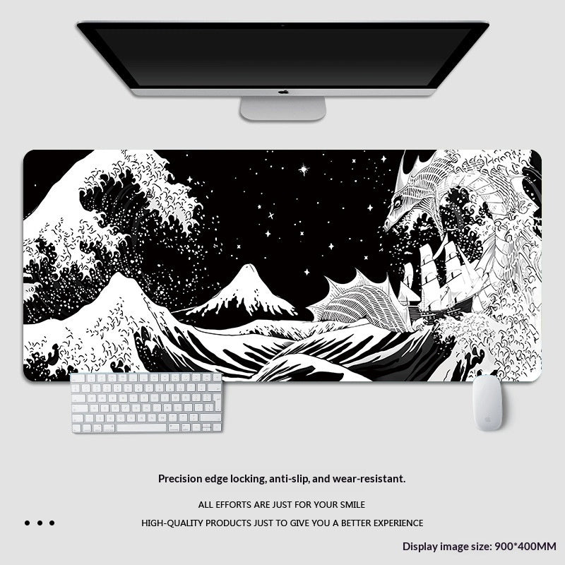 Large desk mat with dragon and mountain design on a white surface